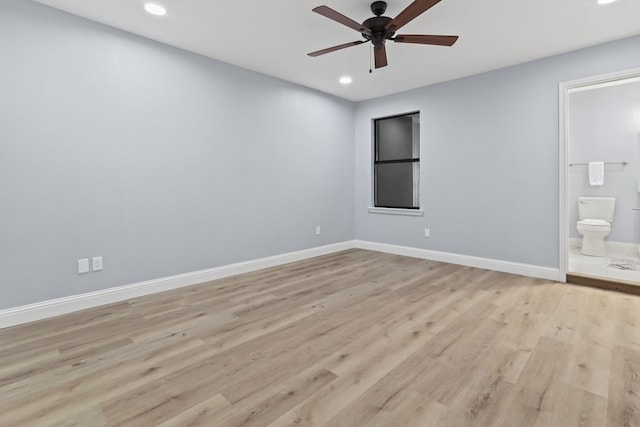 empty room featuring ceiling fan and light wood-type flooring