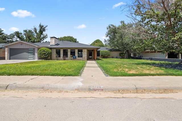 view of front of house with a front lawn and a garage