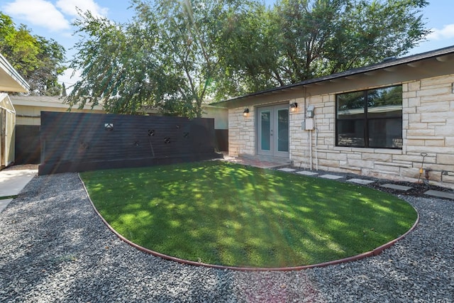 view of yard with french doors