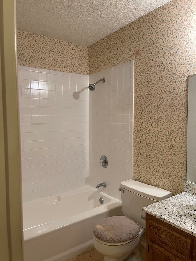 4400 Palmer Dr, Midland, TX 79705 - full bath with wallpapered walls, a textured ceiling, vanity, bathtub / shower combination, and toilet