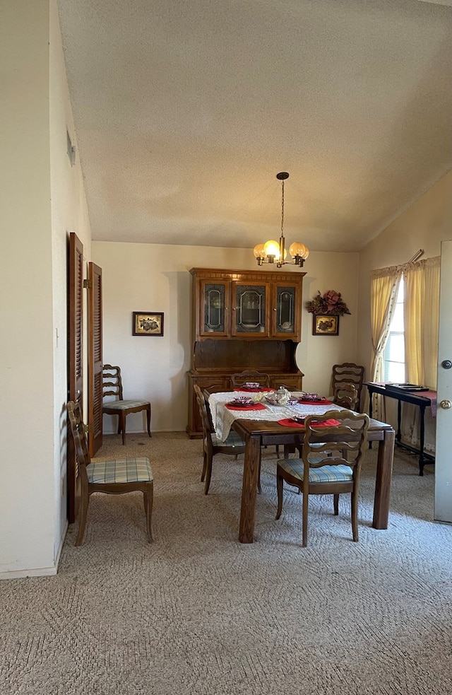 4400 Palmer Dr, Midland, TX 79705 - dining space with a chandelier, light carpet, a textured ceiling, and vaulted ceiling