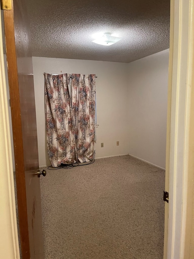 4400 Palmer Dr, Midland, TX 79705 - carpeted spare room featuring a textured ceiling