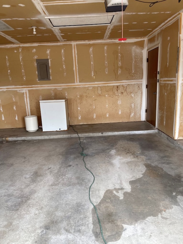 4400 Palmer Dr, Midland, TX 79705 - garage with electric panel and a garage door opener