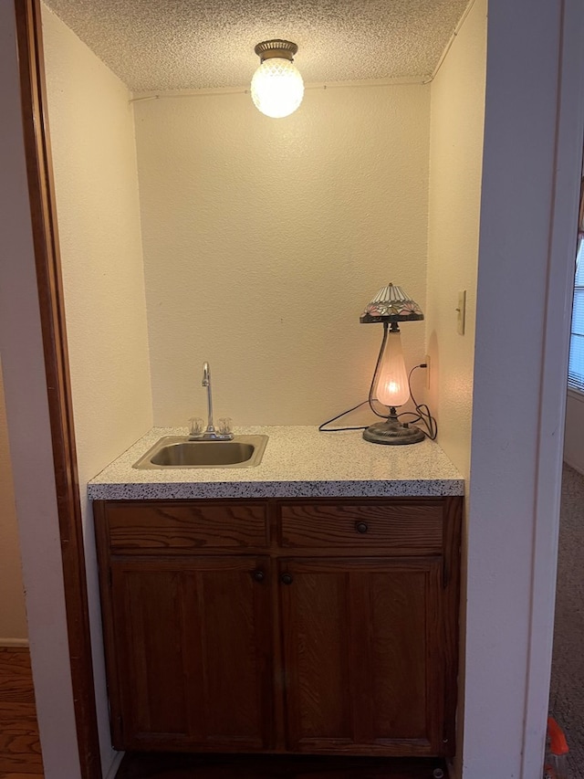 4400 Palmer Dr, Midland, TX 79705 - indoor wet bar featuring a textured ceiling