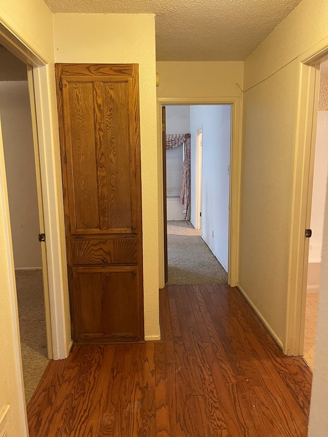 4400 Palmer Dr, Midland, TX 79705 - hall featuring dark wood-style floors and a textured ceiling