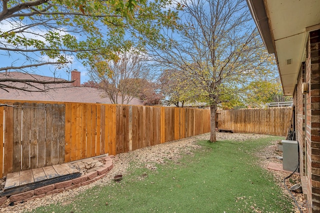 view of yard featuring a fenced backyard