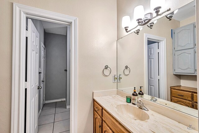 bathroom with tile patterned flooring and vanity