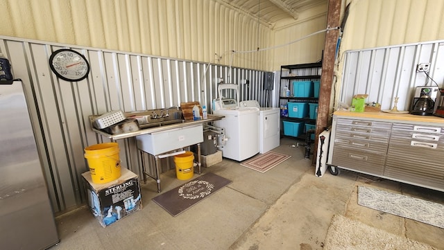 garage with washing machine and dryer