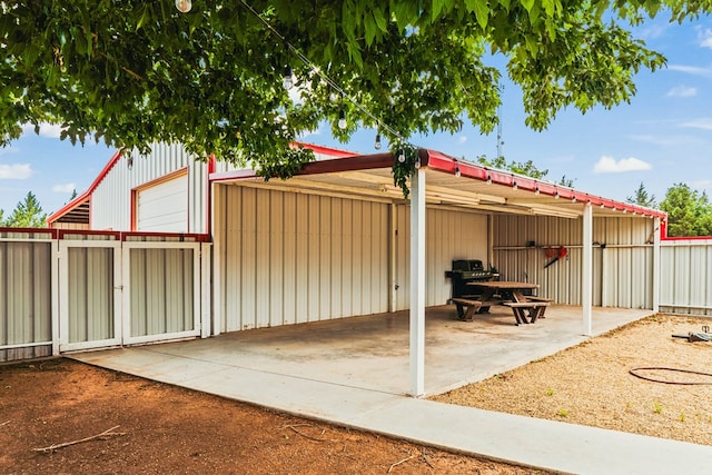 491 County Rd 202, Seminole, TX 79360 - view of patio with a detached garage