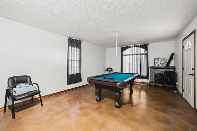 491 County Rd 202, Seminole, TX 79360 - game room featuring pool table, a textured ceiling, finished concrete floors, and baseboards