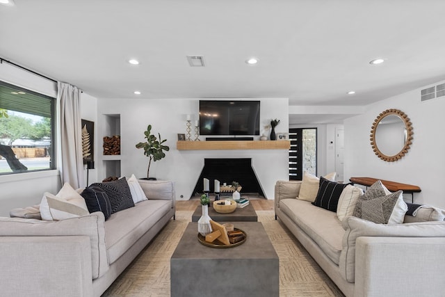 1611 W Tennessee Ave, Midland, TX 79701 - living room with recessed lighting, a fireplace, and light wood-type flooring