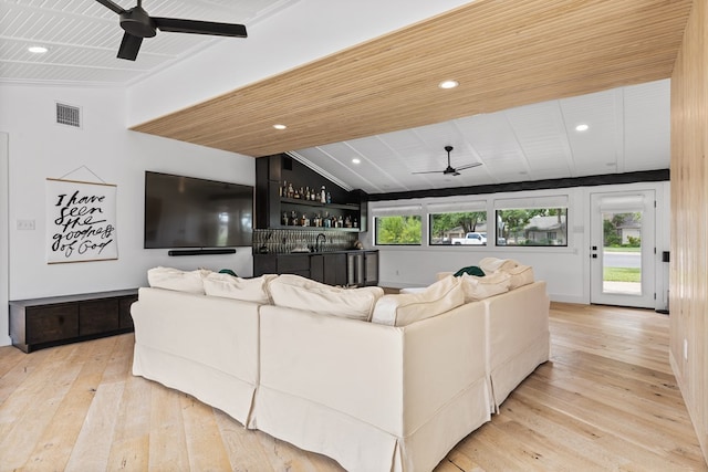 1611 W Tennessee Ave, Midland, TX 79701 - living area with ceiling fan, wet bar, light wood finished floors, wooden ceiling, and vaulted ceiling