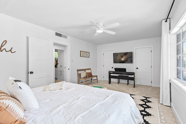 1611 W Tennessee Ave, Midland, TX 79701 - bedroom featuring light colored carpet, a ceiling fan, and baseboards