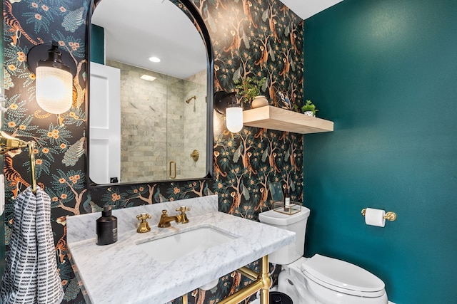 1611 W Tennessee Ave, Midland, TX 79701 - bathroom featuring a sink, a stall shower, toilet, wallpapered walls, and baseboards