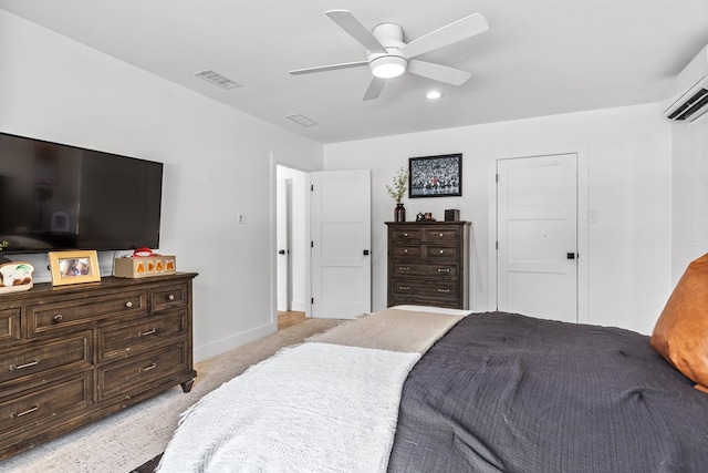 1611 W Tennessee Ave, Midland, TX 79701 - bedroom featuring an AC wall unit, ceiling fan, light carpet, and baseboards