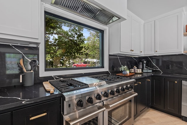 1611 W Tennessee Ave, Midland, TX 79701 - kitchen featuring range with two ovens, dark stone counters, white cabinetry, and dark cabinetry