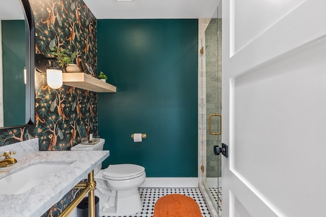 1611 W Tennessee Ave, Midland, TX 79701 - full bath with a stall shower, tile patterned floors, toilet, vanity, and baseboards