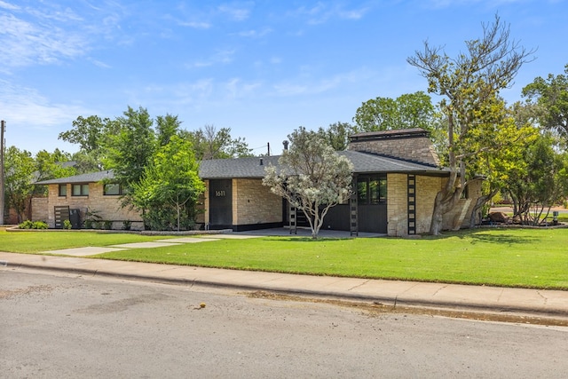1611 W Tennessee Ave, Midland, TX 79701 - mid-century inspired home with a front yard and stone siding
