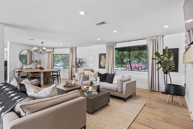 1611 W Tennessee Ave, Midland, TX 79701 - living area with light wood finished floors, recessed lighting, and a chandelier
