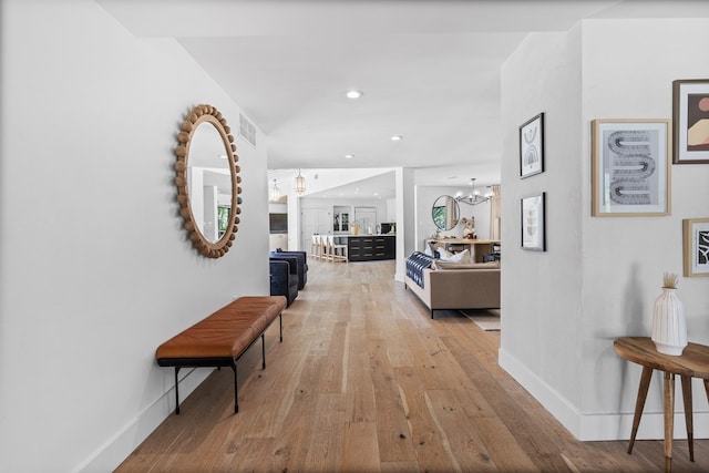 1611 W Tennessee Ave, Midland, TX 79701 - corridor with a chandelier, light wood-style floors, baseboards, and recessed lighting