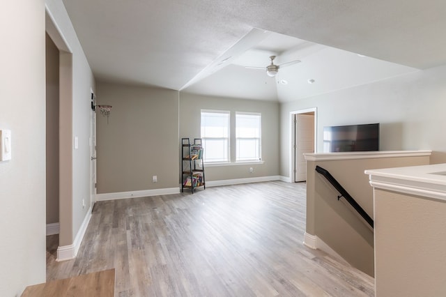 6004 Silent Rain, Midland, TX 79705 - unfurnished living room with light wood finished floors and a ceiling fan