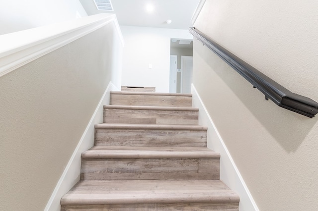 6004 Silent Rain, Midland, TX 79705 - stairway featuring a textured wall