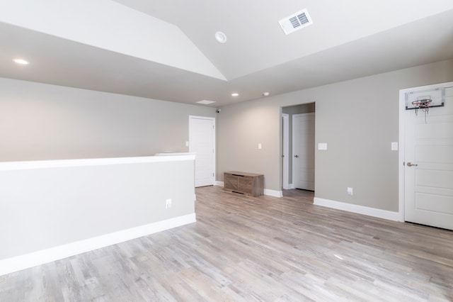 6004 Silent Rain, Midland, TX 79705 - unfurnished room featuring lofted ceiling, recessed lighting, and light wood-style flooring