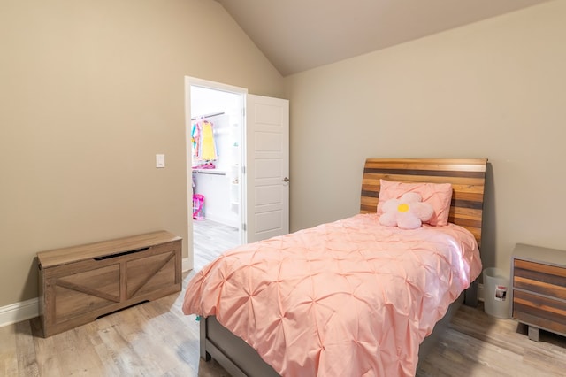 6004 Silent Rain, Midland, TX 79705 - bedroom featuring wood finished floors and lofted ceiling
