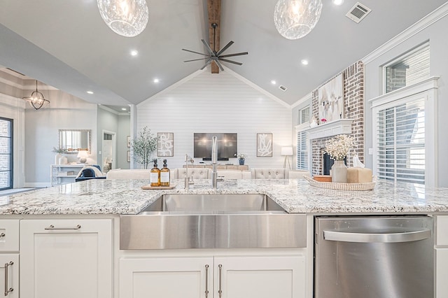 kitchen with visible vents, dishwasher, open floor plan, decorative light fixtures, and white cabinetry