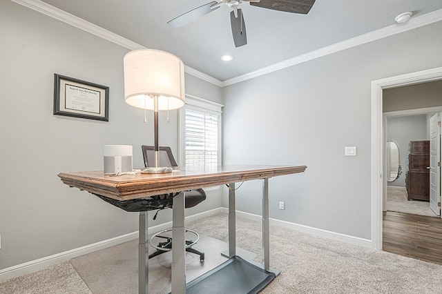 office with light colored carpet, crown molding, baseboards, and ceiling fan