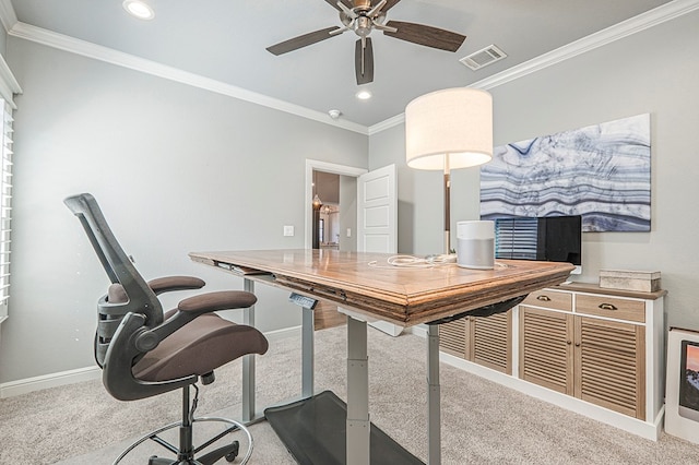 office with ornamental molding, light colored carpet, visible vents, and baseboards