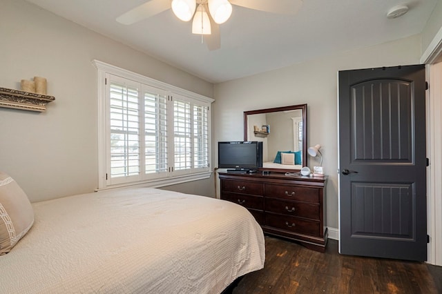 bedroom featuring ceiling fan and dark hardwood / wood-style flooring