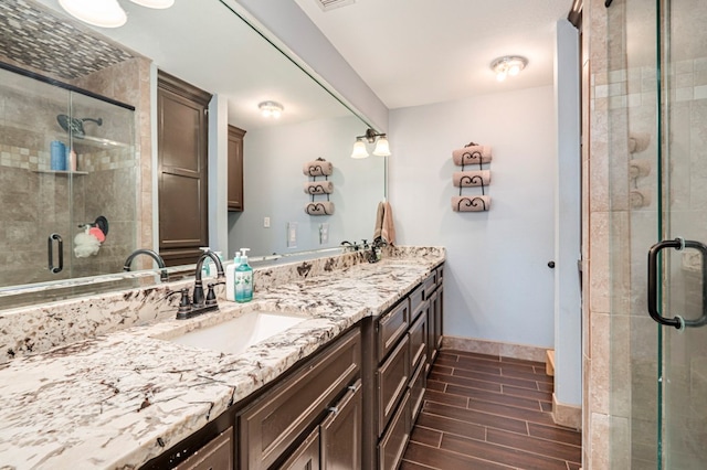 bathroom with vanity and an enclosed shower