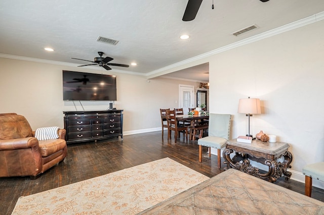 living room featuring dark hardwood / wood-style flooring and ornamental molding