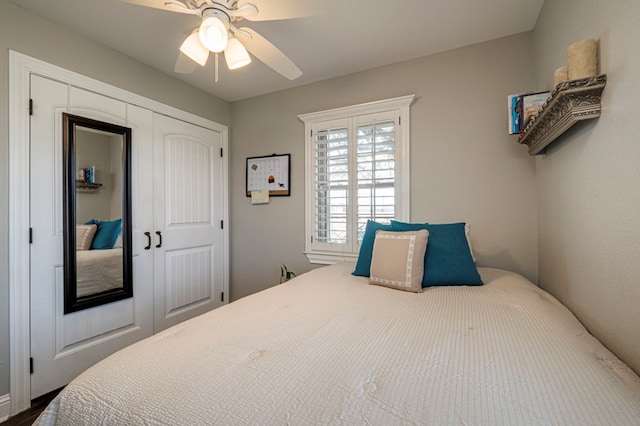 bedroom featuring ceiling fan and a closet