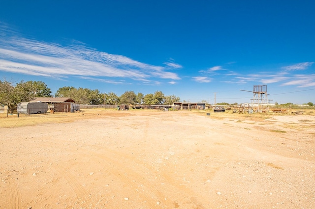 view of yard with a rural view