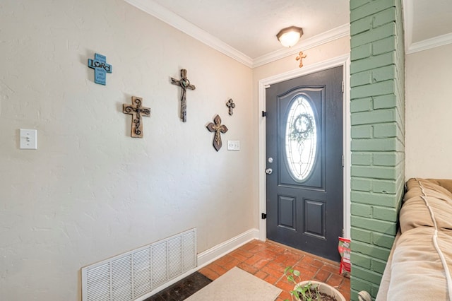 foyer entrance featuring crown molding