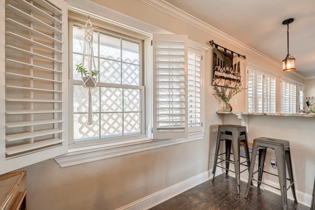 interior space with ornamental molding and dark wood-type flooring