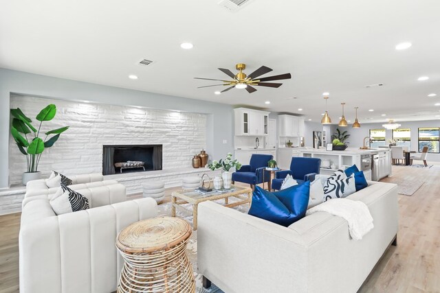 2208 Bedford Dr, Midland, TX 79701 - living room featuring light wood finished floors, visible vents, recessed lighting, and ceiling fan