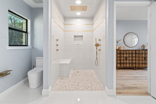 2208 Bedford Dr, Midland, TX 79701 - bathroom featuring baseboards, toilet, and walk in shower