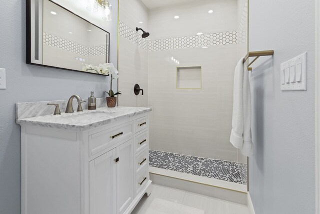 2208 Bedford Dr, Midland, TX 79701 - full bathroom featuring vanity and a tile shower