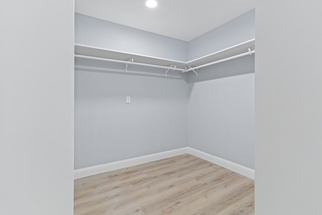 2208 Bedford Dr, Midland, TX 79701 - spacious closet featuring wood finished floors