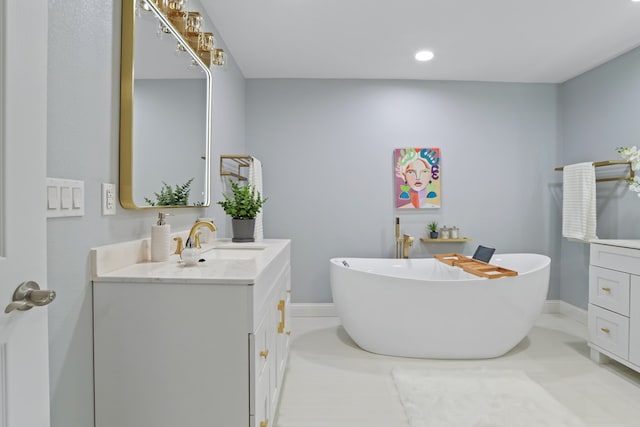 2208 Bedford Dr, Midland, TX 79701 - bathroom with a soaking tub and vanity
