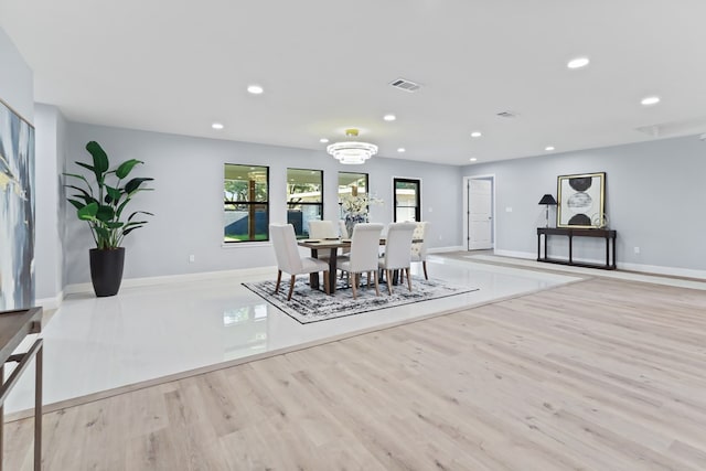 2208 Bedford Dr, Midland, TX 79701 - dining area with recessed lighting, wood finished floors, and visible vents