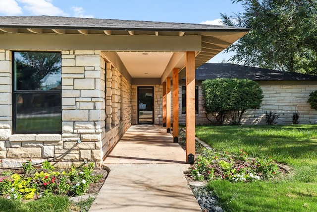 2208 Bedford Dr, Midland, TX 79701 - doorway to property featuring stone siding and a yard