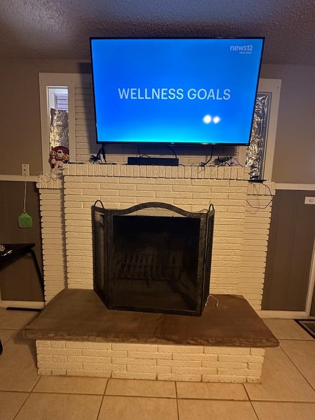 interior details with a fireplace and a textured ceiling