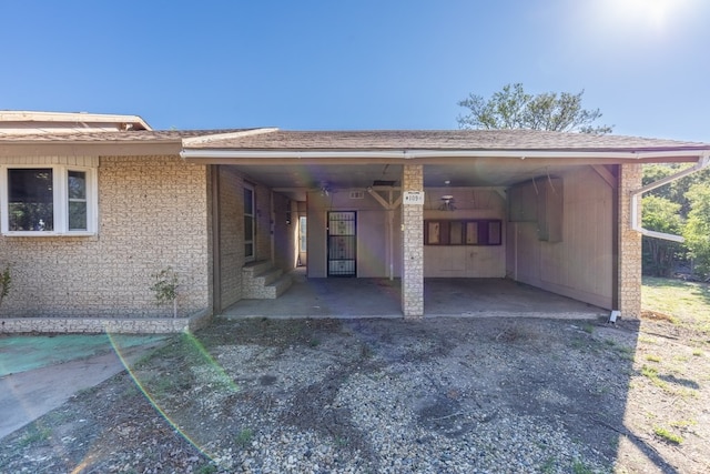 view of parking / parking lot featuring a carport