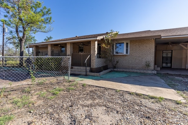 single story home with brick siding, a patio area, and fence