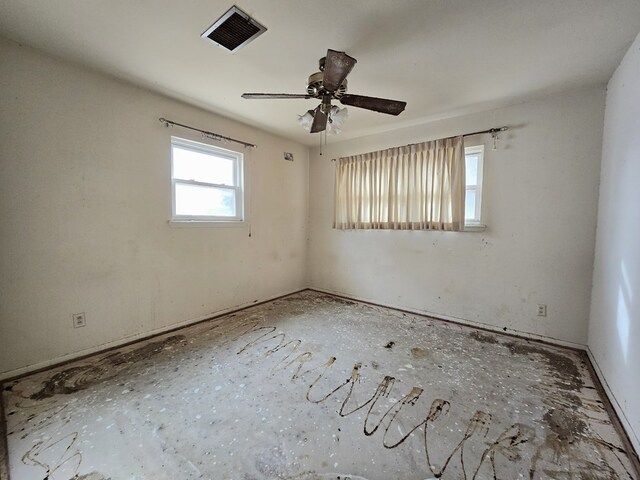 unfurnished room with visible vents