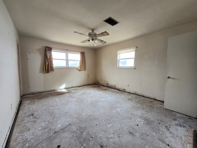 spare room featuring a healthy amount of sunlight and visible vents